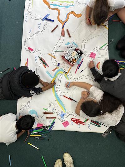 Children discussing and creating artworks. Anti racism education (Children's Parliament 2024)