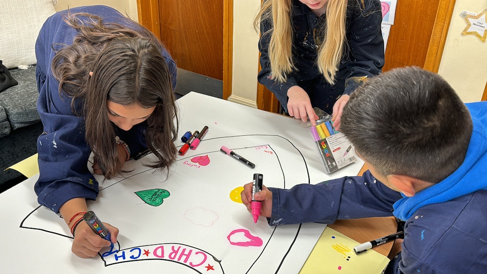 Members of Children's Parliament use art materials to prepare for their annual meeting with the Scottish Cabinet